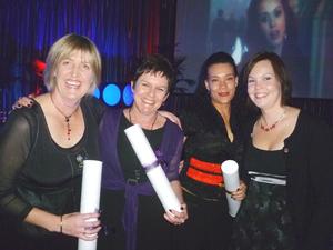 left to right Hayley Stevenson, Colleen Topping and Zahra Iliff collect their awards joined by Housemart's Katrina Roberts.